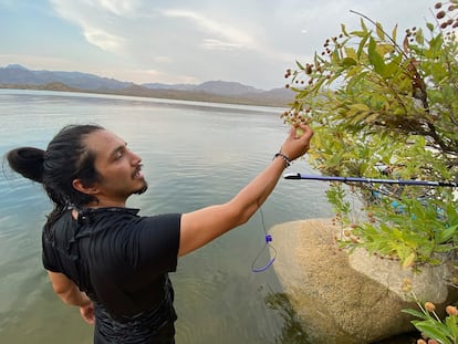 In a photo provided by Roxanne Cruz-de Hoyos, Gabriel Trujillo conducts field research for his doctorate in Arizona. His research across North America was tragically cut short last week in Mexico, where Trujillo’s father says he was shot seven times. Authorities discovered his body on June 22 in the state of Sonora, in northwest Mexico — days after his fiancée reported him missing. (Roxanne Cruz-de Hoyos via AP)