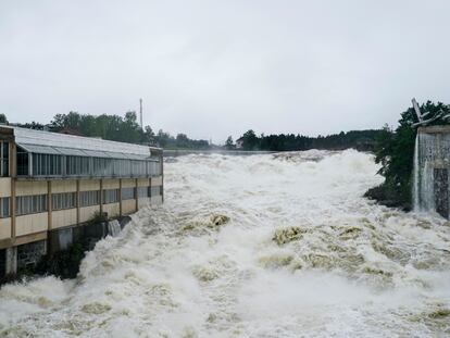 The Storelva river flows through Hoenefoss Center in Norway, Wednesday, Aug. 9, 2023