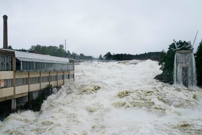 The Storelva river flows through Hoenefoss Center in Norway, Wednesday, Aug. 9, 2023