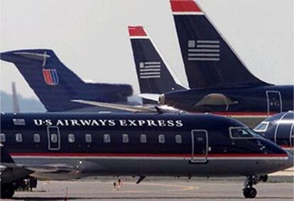 Imagen de archivo de varios aviones de la flota estadounidense US Airways en el aeropuerto nacional Reagan.