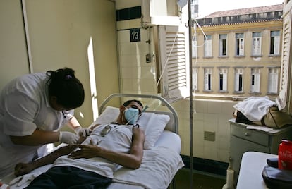 Carlos, a patient with HIV, receives his medication at a hospital in Rio de Janeiro, in a file image.