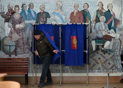 A man leaves a voting station at a St. Petersburg school on Saturday.