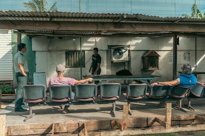 Ariel Morales talks with the inmates in the prison yard.