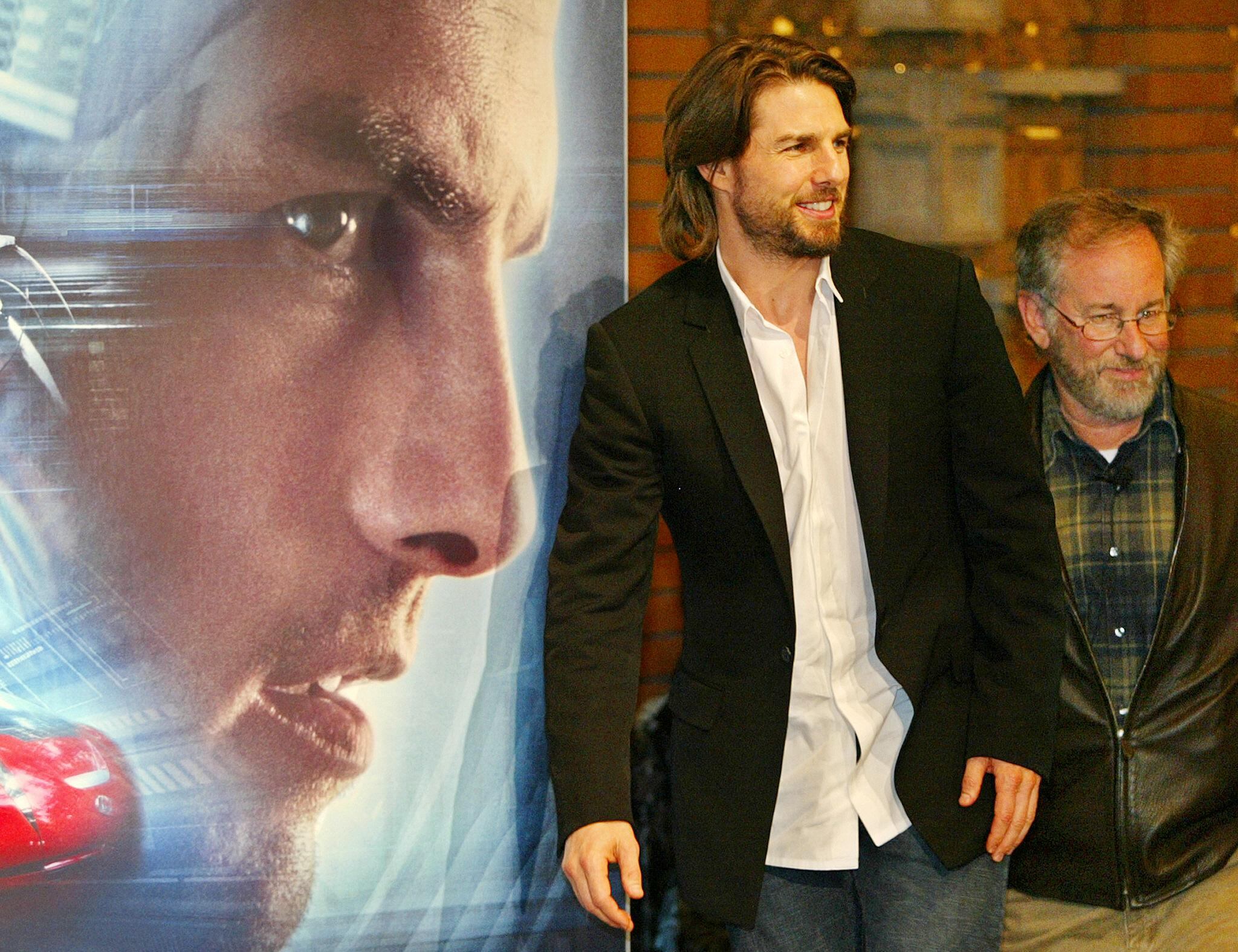 With three days of beard and hair in a 2000s bob, Cruise posed in jeans, a white shirt and a black jacket to promote the film 