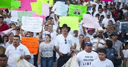 Mireles (with cowboy hat) takes part in the Monday's parade to celebrate the first anniversary of the self-defense forces.