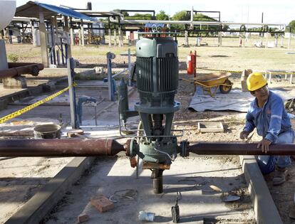 An employee works at a natural gas plant near Santa Cruz, Bolivia.