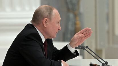Russian President Vladimir Putin chairs a meeting with members of the Security Council in Moscow.