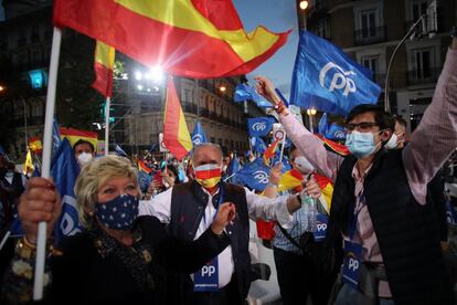 Supporters of the Popular Party celebrate the results outside the party‘s headquarters in Madrid.