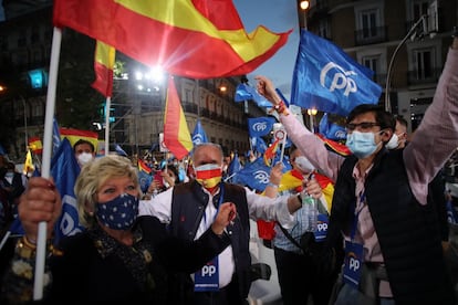 Supporters of the Popular Party celebrate the results outside the party‘s headquarters in Madrid.