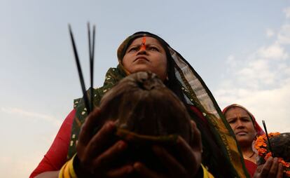 A Nepali Hindu devotee takes part in a ritual worshipping the sun god during the Chhath Festival as she stands in the Bagmati River in Kathmandu on October 26, 2017.
The Chhath Festival, also known as Surya Pooja, or worship of the sun, is observed in parts of India and Nepal and sees devotees pay homage to the sun and water gods. Devotees undergo a fast and offer water and milk to the sun god at dawn and dusk on the banks of rivers or small ponds and pray for the longivety and health of their spouse. / AFP PHOTO / PRAKASH MATHEMA