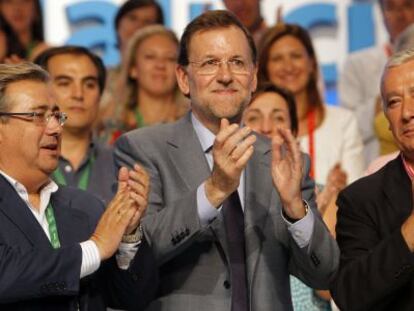 De izquierda a derecha, Zoido, Rajoy y Arenas, en julio del pasado a&ntilde;o. 