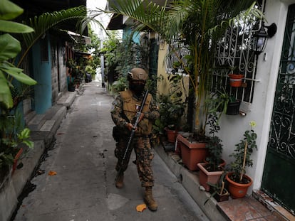 A Salvadoran soldier patrols the street in Soyapango municipality.