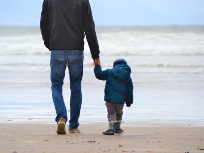 A father and son at the beach.