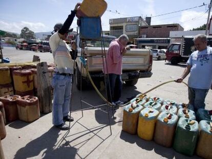 Smugglers filling up gasoline tanks on the Colombian side of the border with Venezuela in 2009.