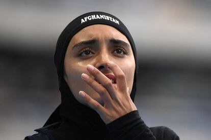 Afghanistan's Kamia Yousufi looks at the results board after competing in the Women's 100m Preliminary Round during the athletics event at the Rio 2016 Olympic Games at the Olympic Stadium in Rio de Janeiro on August 12, 2016.   / AFP PHOTO / OLIVIER MORIN