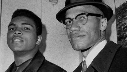 Cassius Marcellus Clay (Muhammad Ali) with Black Muslim leader Malcolm X at 125th St. and Seventh Ave.