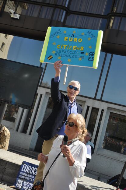 The president of EuroCitizens, Michael Harris, holds up one of the placards at the demonstration.