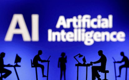 Figurines with computers and smartphones are seen in front of the words "Artificial Intelligence AI" in this illustration taken, February 19, 2024