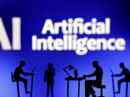 Figurines with computers and smartphones are seen in front of the words 'Artificial Intelligence AI' in this illustration taken, February 19, 2024.