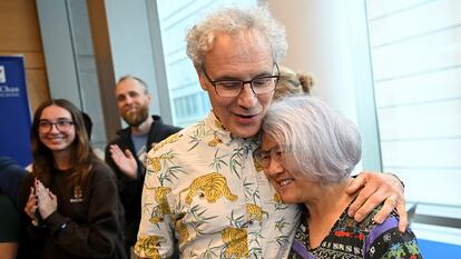 Victor Ambros hugs his partner and wife Rosalind Lee at the University of Massachusetts, where they both work.
