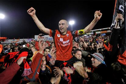 Pablo Infante is carried from the field by jubilant supporters.