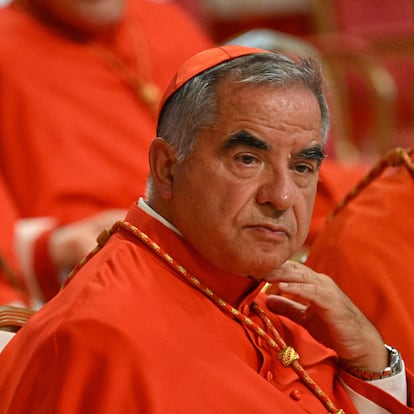 (FILES) Italian Cardinal Giovanni Angelo Becciu (R) waits prior to the start of a consistory during which 20 new Cardinals are to be created by the Pope, on August 27, 2022 at St. Peter's Basilica in The Vatican. A Vatican court on December 16, 2023 convicted a once powerful Italian cardinal to five years and six months in jail for financial crimes at the end of a historic trial. Angelo Becciu, 75, a former advisor to Pope Francis who was once considered a papal contender himself, had strongly denied charges that included embezzlement and abuse of office. (Photo by Alberto PIZZOLI / AFP)