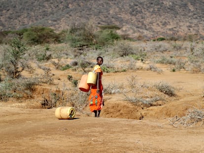 A Samburu woman fetches water during a drought in Loolkuniyani Primary School, Samburu County, Kenya, Oct. 16, 2022