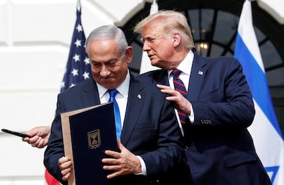 FILE PHOTO: Israel's Prime Minister Benjamin Netanyahu stands with U.S. President Donald Trump after signing the Abraham Accords, normalizing relations between Israel and some of its Middle East neighbors, on the South Lawn of the White House in Washington, U.S., September 15, 2020. REUTERS/Tom Brenner/File Photo