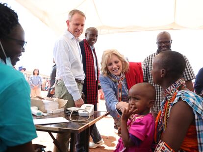 US first Lady Jill Biden, center, greets women of the Maasai community as they explain the drought situation in Ngatataek, Kajiado Central, Kenya, Sunday, Feb. 26, 2023. Biden is in Kenya on the second and final stop of her trip. (AP Photo/Brian Inganga)