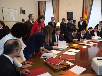 Jailed Catalan separatists complete the paperwork to be sworn in as deputies.