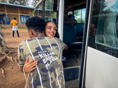 An Eritrean refugee on his way to Canada says goodbye to a colleague who is staying in Gashora.