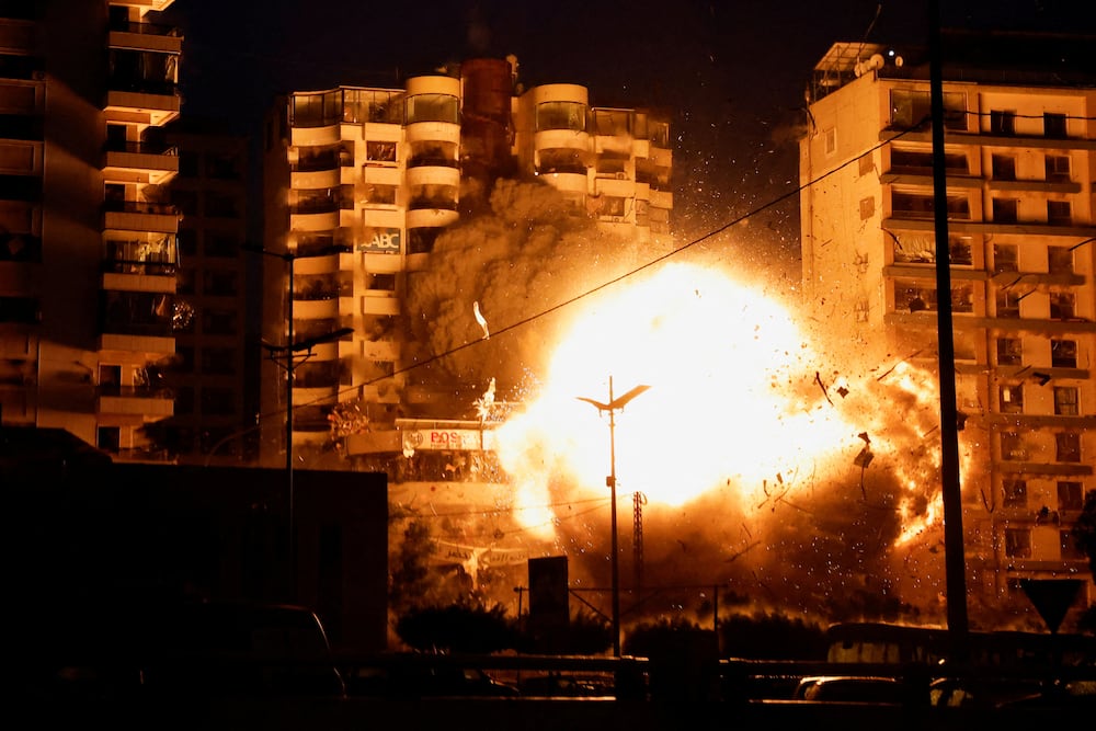 A view shows the moment of an Israeli strike on a building, amid the ongoing hostilities between Hezbollah and Israeli forces, in the Chiyah district of Beirut's southern suburbs, Lebanon, November 25, 2024. REUTERS/Adnan Abidi  