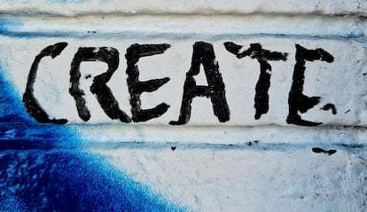 Imagen de un graffiti en una pared con la palabra Create