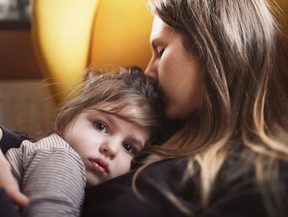 Mother hugs sad daughter