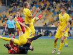 Kiev (Ukraine), 13/10/2020.- Sergio Ramos (down) of Spain in action against Eduard Sobol (L), Evgen Makarenko (C) and Illia Zabarnyi (R) of Ukraine in action during the UEFA Nations League group stage, league A, group 4 soccer match between Ukraine and Spain in Kiev, Ukraine, 13 October 2020. (España, Ucrania) EFE/EPA/SERGEY DOLZHENKO