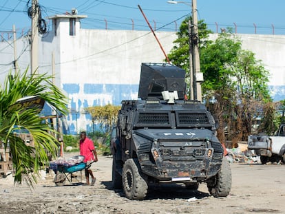 A man walks past the National Penitentiary after an attack by armed gangs in Port-au-Prince, Haiti, on March 3, 2024.