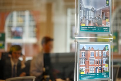 Houses for sale are displayed at a Foxtons Group property agency window in London, Britain, Monday, March 4, 2024.