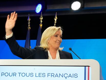 Far-right leader Marine Le Pen gestures after speaking after the early result projections of the French presidential election runoff were announced in Paris, Sunday, April 24, 2022. French polling agencies are projecting that centrist incumbent Emmanuel Macron will win France's presidential runoff Sunday, beating far-right rival Marine Le Pen in a tight race that was clouded by the Ukraine war and saw a surge in support for extremist ideas. (AP Photo/Michel Euler)