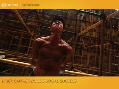 For most construction workers, lunch is a welcome break to rest and refuel. Not for Shi Shenwei. the 23-year-old spends his midday break jumping and swinging through a maze of scaffolding poles, performing a fitness routine that has made him China's latest social media sensation. Known online as Brick Carrier Little Wei, he transforms the dusty building site where he works in southern Fujian province into a personal gym, with bricks for dumbbells and scaffolding poles for high bars.  REUTERS/Thomas Peter        SEARCH "BRICK CARRIER" FOR THIS STORY. SEARCH "WIDER IMAGE" FOR ALL STORIES.  TPX IMAGES OF THE DAY     Matching text: CHINA-FITNESS/BUILDER