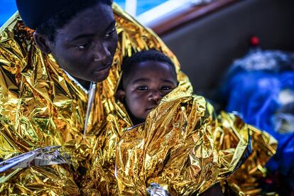 A woman and her child aboard the Astral after being rescued on Monday. 