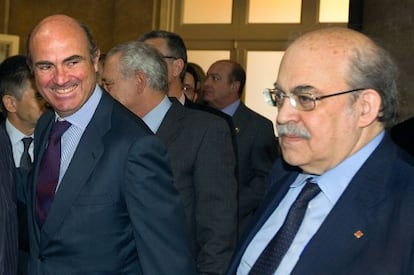 El ministro de Economía, Luis de Guindos, y Andreu Mas-Colell.