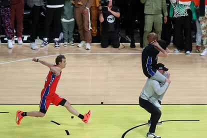 Mac McClung of the Philadelphia 76ers shoots during the slam dunk competition of the NBA basketball All-Star weekend Saturday, Feb. 18, 2023, in Salt Lake City. (AP Photo/Rob Gray)