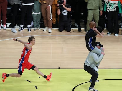 Mac McClung of the Philadelphia 76ers shoots during the slam dunk competition of the NBA basketball All-Star weekend Saturday, Feb. 18, 2023, in Salt Lake City. (AP Photo/Rob Gray)