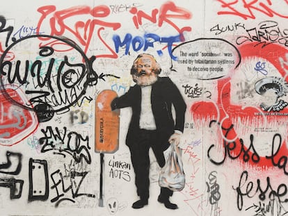 Karl Marx en un grafiti en el Muro de Berlín.