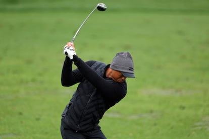 Tiger Woods of the United States warms up on the practice area during the third round of the 2023 Masters Tournament