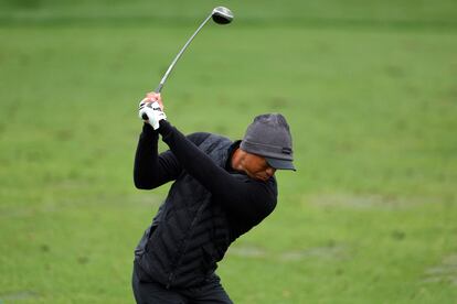 Tiger Woods of the United States warms up on the practice area during the third round of the 2023 Masters Tournament