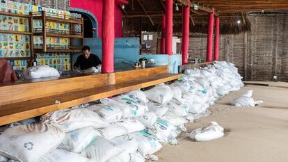 Sand bags are piled up in front of a bar to prevent flooding as Hurricane Norma barrels towards the Baja California peninsula, in Cabo San Lucas, Mexico, October 20, 2023.