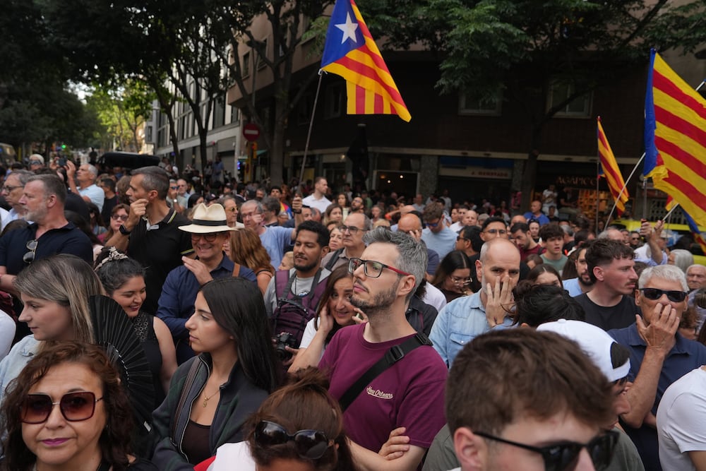 BARCELONA, SPAIN - JUNE 10: People gather ahead of a visit to Basílica de la Sagrada Família by Pope Leo XIV on June 10, 2026 in Barcelona, Spain. Pope Leo XIV is making an apostolic journey to Spain from June 612, marking the first papal visit to the country since Benedict XVI visited in 2011. During the trip Pope Leo travels to Madrid, Barcelona, and the Canary Islands of Gran Canaria and Tenerife. Many of his planned engagements center on issues around marginalized people, youth, and migrants, alongside meetings with the Spanish royals, government figures, and church officials. A highlight of the itinerary sees Pope Leo inaugurate the recently completed Tower of Jesus Christ spire at the Basílica de la Sagrada Familia in Barcelona, to coincide with the 100th anniversary of the architect Antoni Gaudí's death. (Photo by Adri Salido/Getty Images)