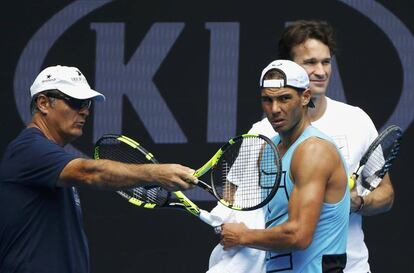 Spain's Rafael Nadal reacts with his coaches Toni Nadal (L) and former player Carlos Moya during a training session ahead of the Australian Open tennis tournament in Melbourne, Australia, January 15, 2017. REUTERS/Issei Kato