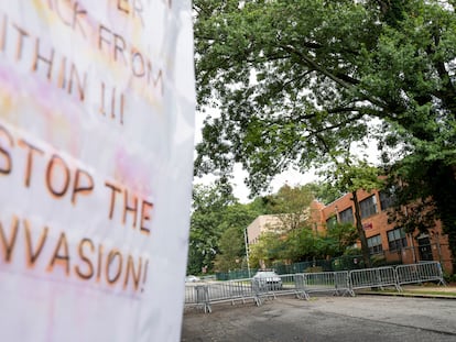 Protest signs are posted outside the former Saint John Villa Academy being repurposed as a shelter for homeless migrants, Wednesday, Sept. 13, 2023, in the Staten Island borough of New York.